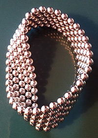 about 100 magnet balls arranged to form a Mobius strip