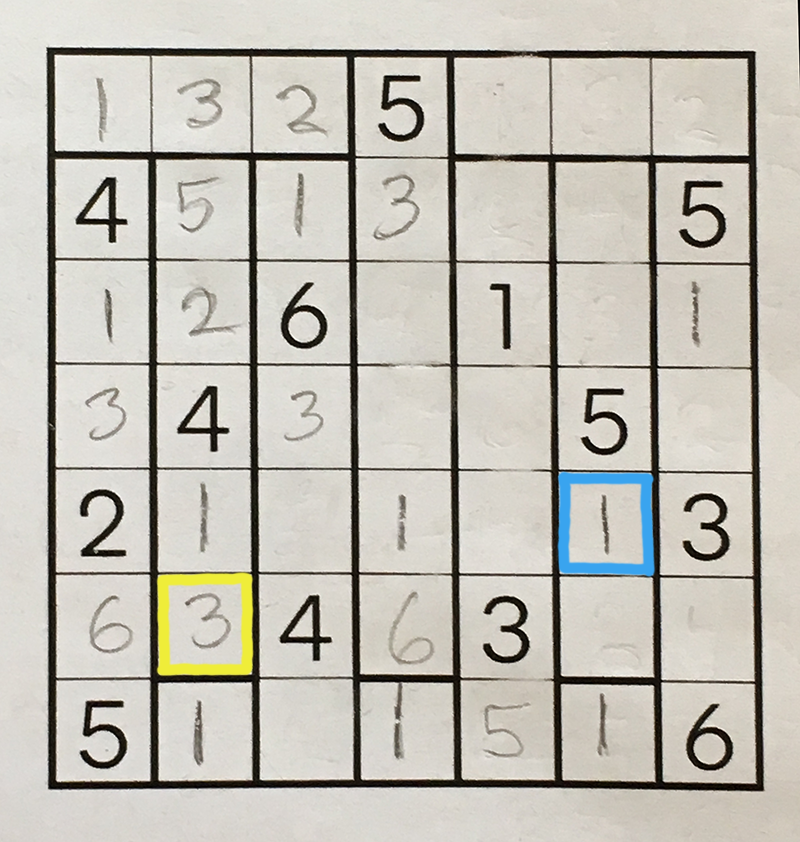 The same partially completed puzzle grid, with two squares marked by blue and yellow outlines.